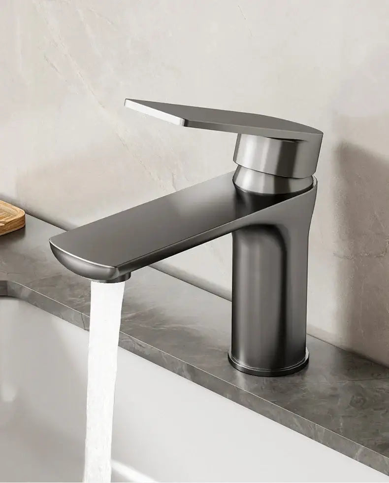 Decorbites modern stainless steel bathroom sink faucet with matte black finish and brushed metal accents in a sleek design