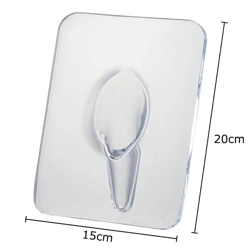 Clear plastic adhesive hook with transparent oval hanging loop attached to modern transparent square vase for flowers