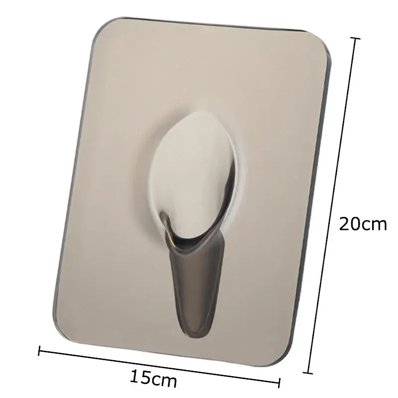 A sleek stainless steel wall hook with rounded edges complements the modern transparent square vase decorbites for flowers
