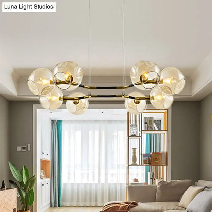 Modern glass globe chandelier pendant light with brass accents and black bars for living room lighting