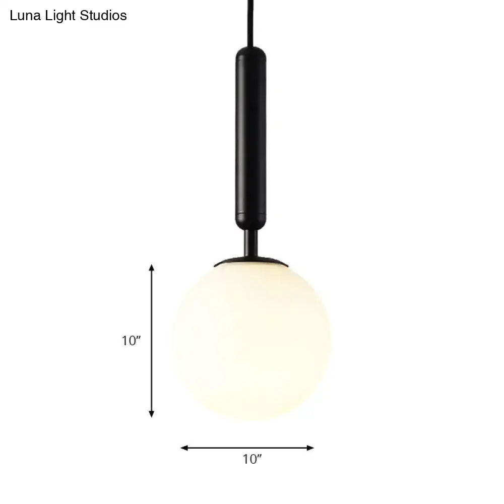 Decorbites modernist pendant light with sleek black and gold finish and 10-inch white glass globe fixture