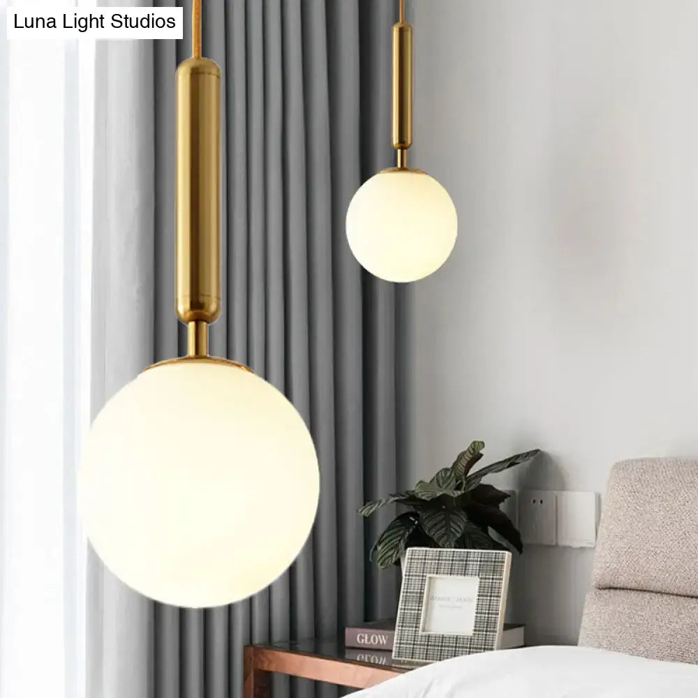 Decorbites modernist white glass pendant light with gold finish and spherical frosted shades in adjustable inches fixture