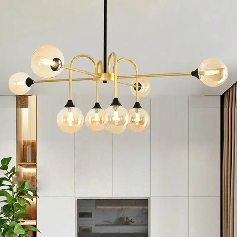 Decorbites modo glass suspension light gold finish with six clear glass bulbs and black accents for dining room