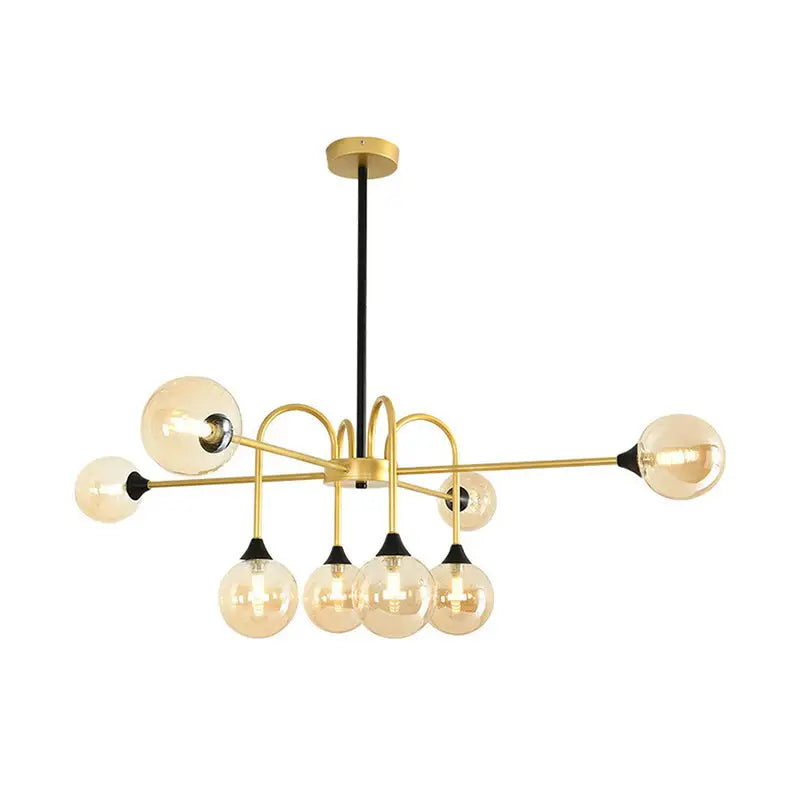 Decorbites modo glass suspension light featuring a gold finish and amber glass bulbs for dining room lighting