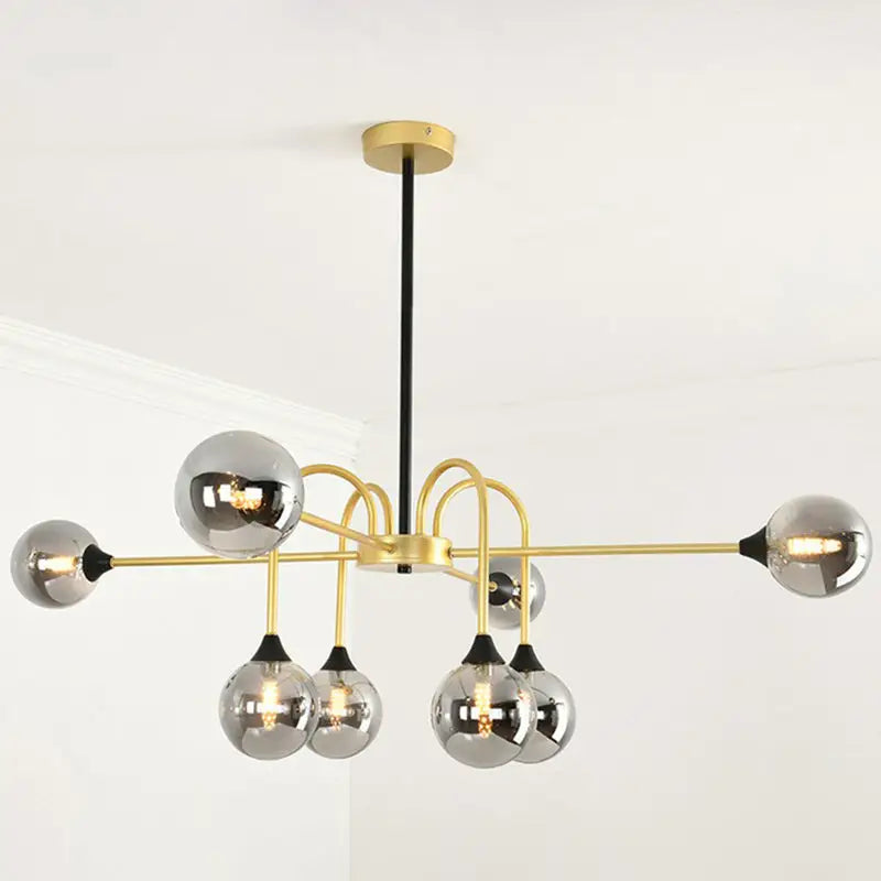 DecorBites™ Modo gold suspension light with six clear glass bulbs and black rod for dining room illumination