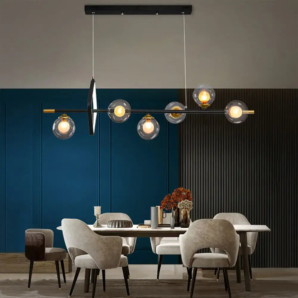 Modern black and brass molecular dining room pendant light with clear glass globe shades for dining room island