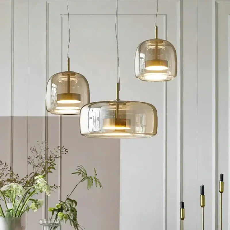 DecorBites™ moroccan amber modern nordic pendant light with translucent amber glass shades and brass accents hanging