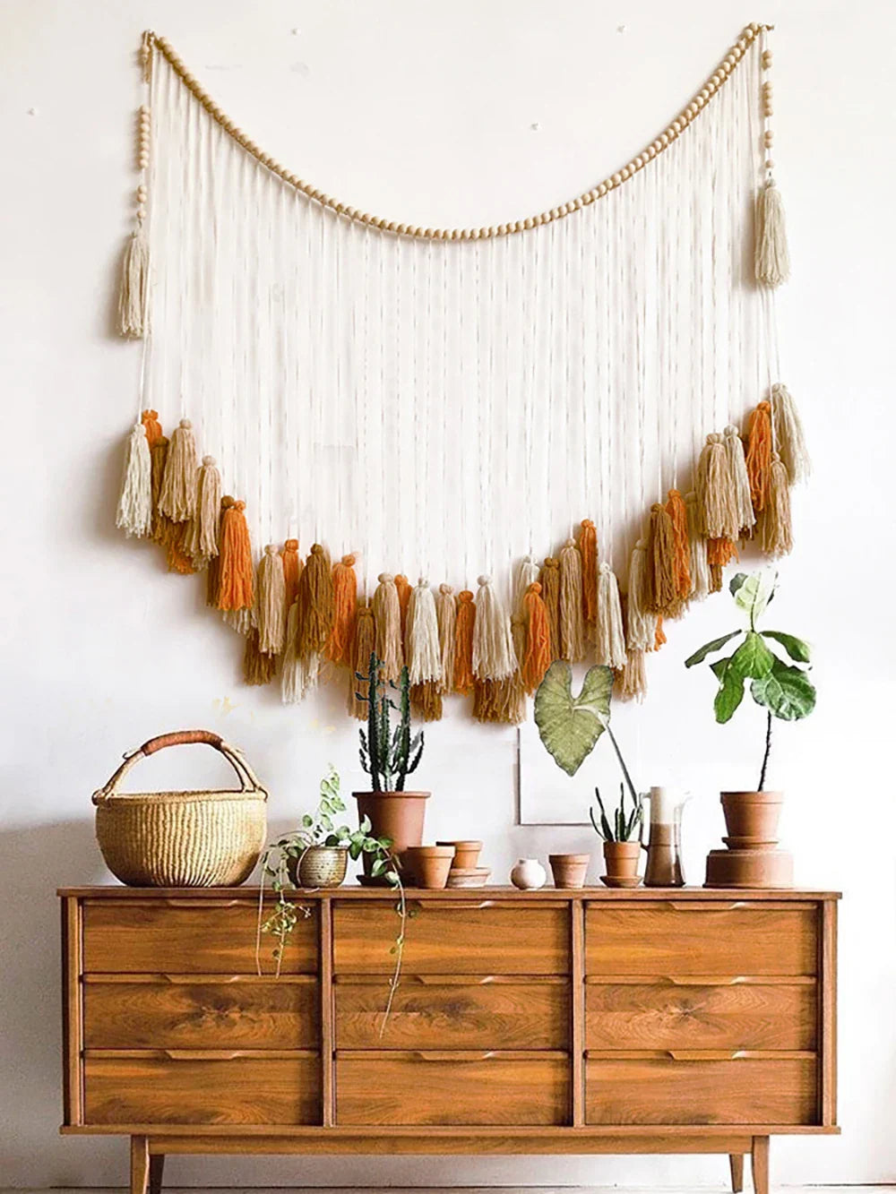 Beige and orange woven macrame wall decor tapestry with wooden beads and tassels for moroccan bohemian wall style