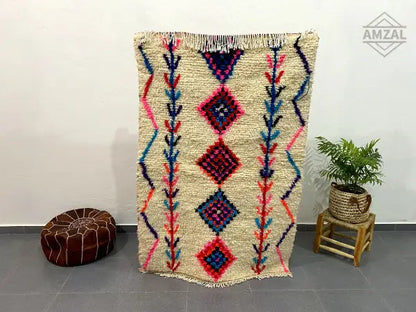 Beige moroccan handmade azilal rug with bold pink blue and purple geometric diamond patterns vertical lines 1.5m x 1m