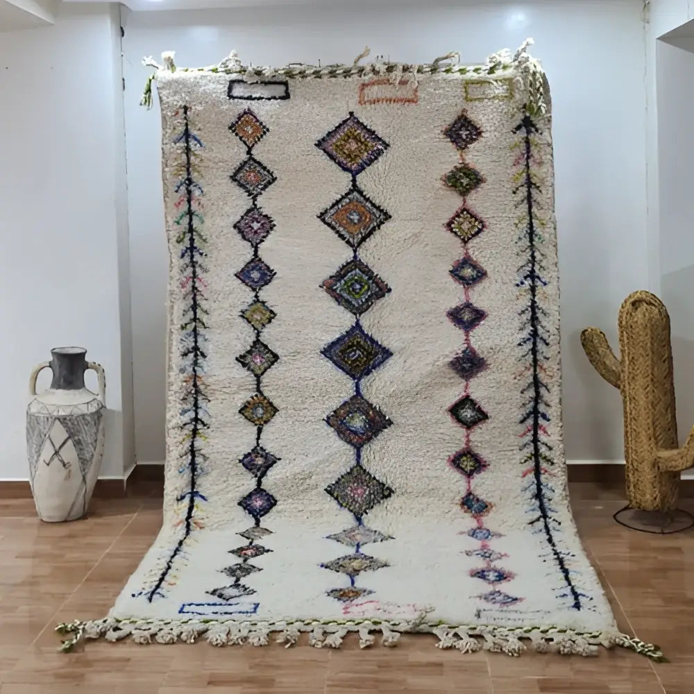 Cream-colored decorbites™ moroccan handmade azilal rug with multicolored geometric motifs in hand-knotted wool