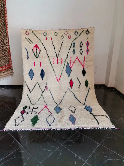 Beige DecorBites™ moroccan handmade azilal berber carpet with colorful geometric patterns on textured woolen surface