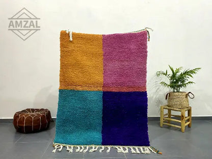 Vibrant moroccan handmade beni ouarain rug with plush wool in mustard yellow magenta teal and deep purple featuring fringe detailing