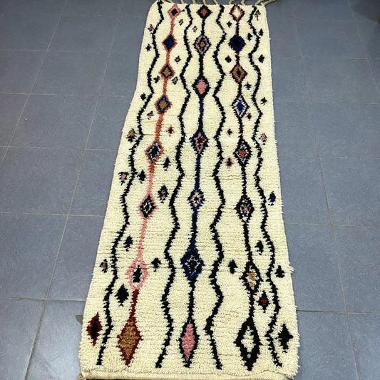 Cream-colored moroccan handmade beni ouarain rug with intricate black pink and navy geometric patterns 2.5m x 0.7m
