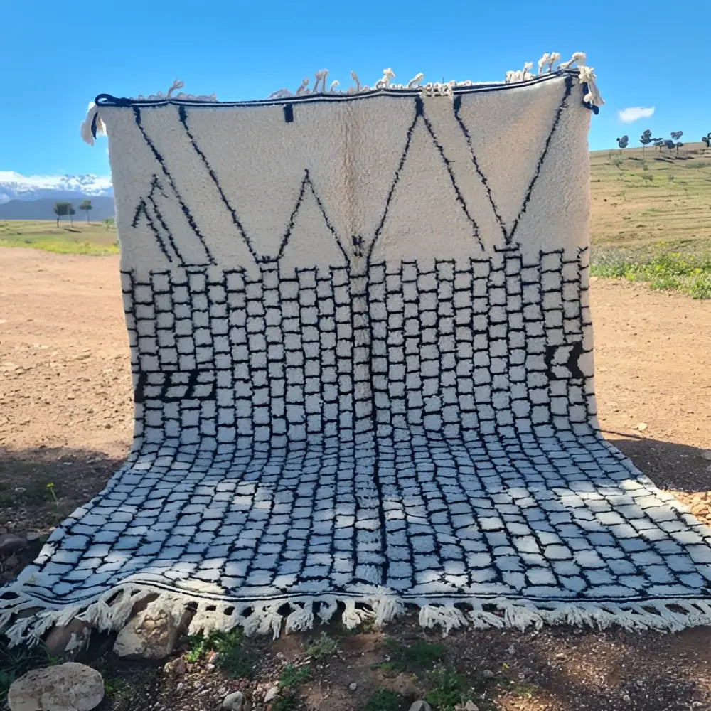 Beige and black geometric-patterned moroccan handmade beni ouarain rug 3m x 2m by skilled artisans with fringed edges
