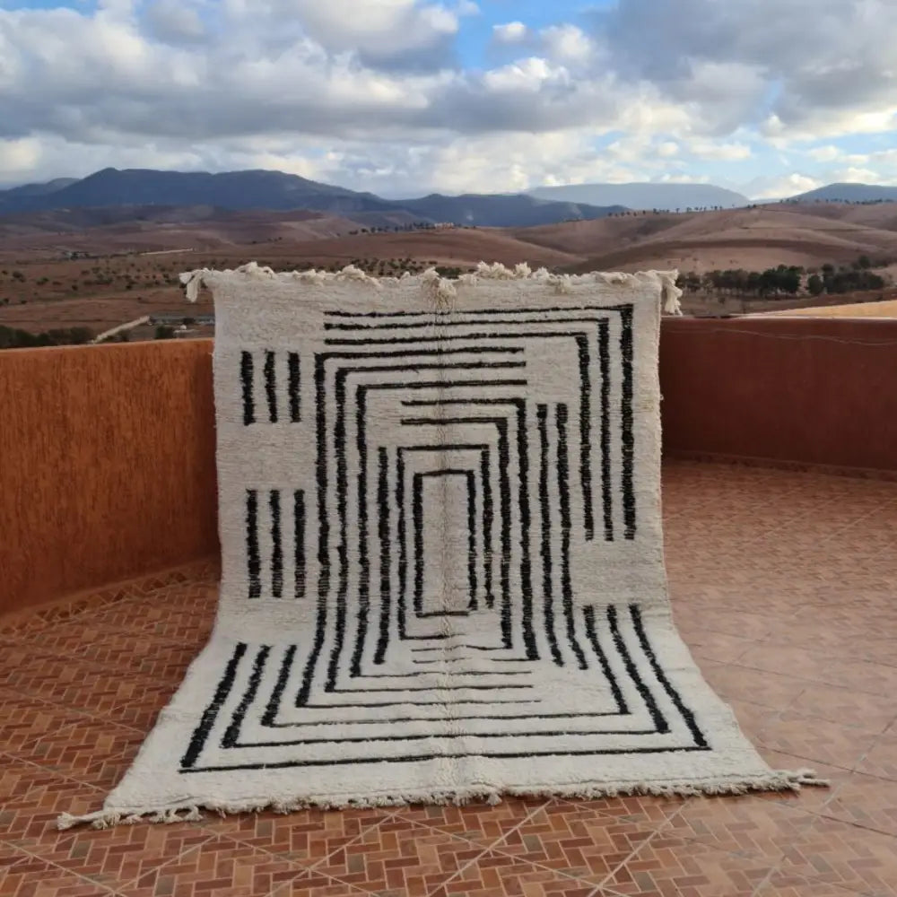 Cream-colored DecorBites™ beni ouarain rug 3m x 2m with bold black geometric patterns and fringed edges