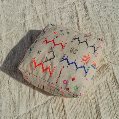 Beige decorbites™ moroccan handmade beniourain pouf with colorful geometric embroidery in natural wool
