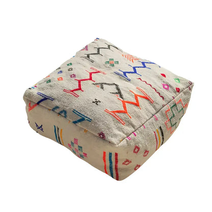 Beige moroccan handmade beniourain pouf with colorful geometric embroidery made from natural wool by DecorBites