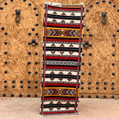 A vibrant moroccan handmade taznakht rug with bold red black white and yellow geometric patterns 200cm x 60 cm