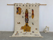 Cream-colored textured wool moroccan handmade traditional azilal carpet with mustard yellow and terracotta geometric patterns