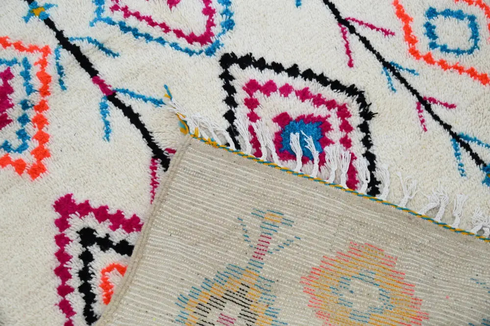 DecorBites moroccan handmade traditional azilal carpet with cream base and bold pink blue orange black teal geometric patterns