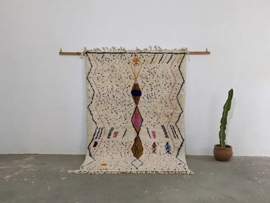 Beige moroccan handmade traditional azilal rug with geometric black pink and brown patterns 246 x 166 cm by DecorBites