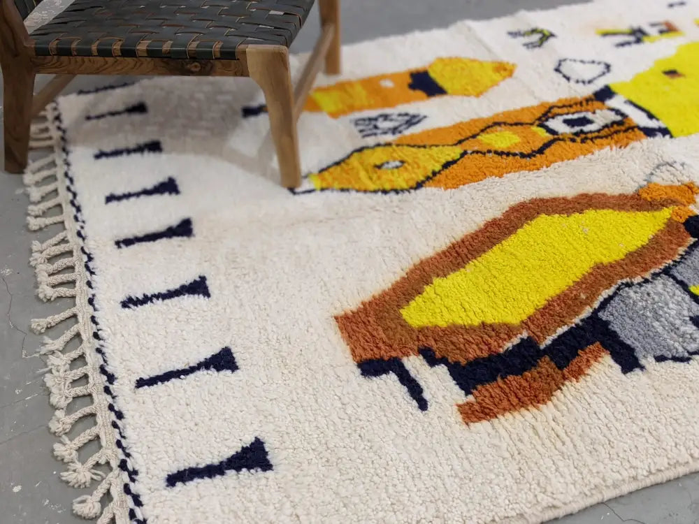Cream-colored DecorBites™ moroccan handmade traditional Azilal rug with bold geometric patterns and fringed edges