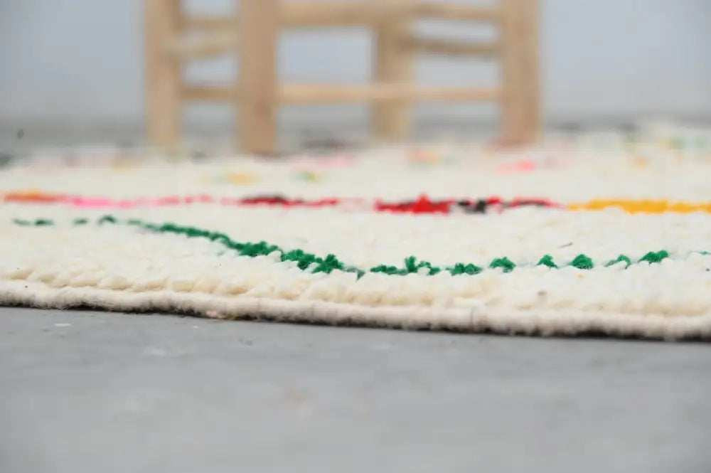 Cream-colored moroccan handmade traditional azilal rug with colorful horizontal stripes green red yellow pink 252 x 145 cm