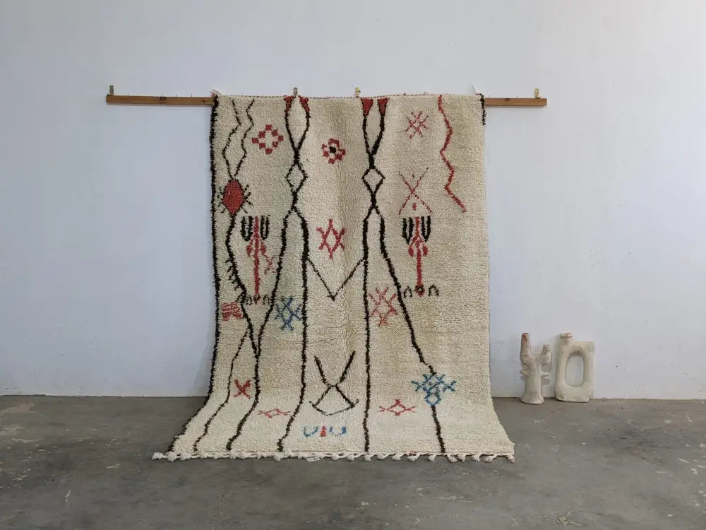 Beige moroccan handmade azilal rug with black red and blue geometric patterns in pure natural wool 253 x 165 cm