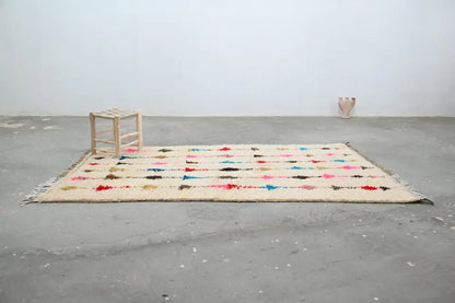 Beige decorbites moroccan handmade traditional azilal rug with colorful red blue pink and black geometric patterns 255 x 155 cm