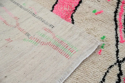 Beige Moroccan handmade traditional Azilal rug with vibrant pink green and black geometric patterns 256 x 136 cm
