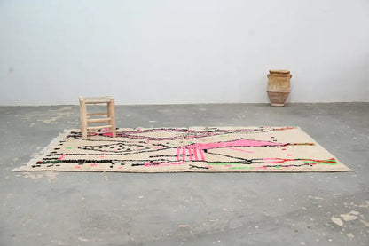 Beige moroccan handmade traditional azilal rug with vibrant pink black and green geometric patterns 256 x 136 cm