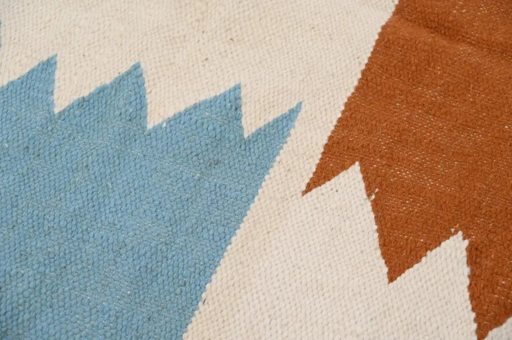 Beige blue and rust-colored moroccan handmade traditional azilal rug with geometric pattern and woven texture 258 x 143 cm