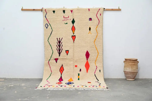 Beige moroccan handmade traditional azilal rug with vibrant red orange green and purple geometric patterns 260 x 148 cm