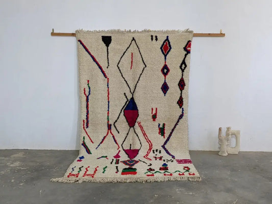 Beige moroccan handmade azilal rug with bold red blue and purple geometric patterns in pure natural wool 265x161 cm