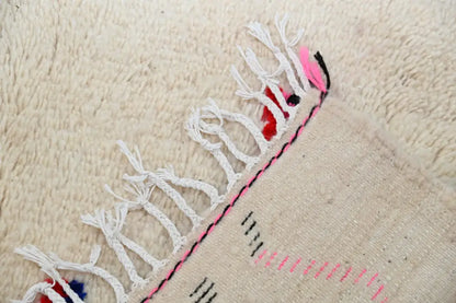 Beige woven decorbites moroccan handmade traditional azilal rug with white fringe and pink black embroidered border