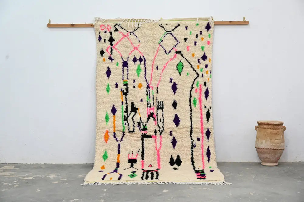Beige moroccan handmade traditional azilal rug with vibrant pink purple green and black geometric patterns 274 x 145 cm