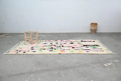 DecorBites™ moroccan handmade traditional azilal rug with cream base and vibrant geometric patterns in pink and green