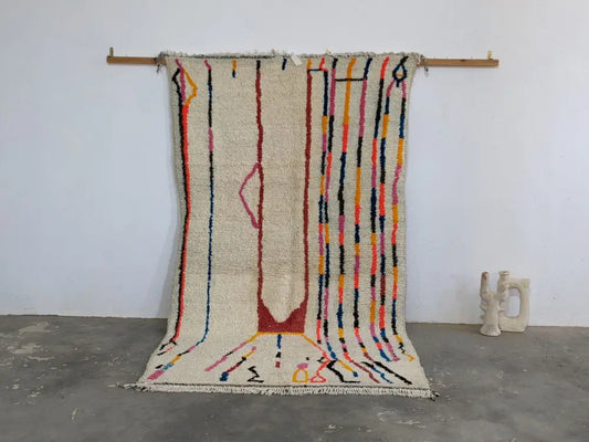 Beige moroccan handmade azilal rug with colorful vertical stripes and central abstract design in pure natural wool