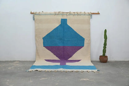 Beige woven moroccan handmade traditional azilal rug with bold turquoise purple geometric design and blue fringe 307 x 196 cm