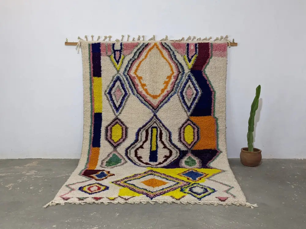 Decorbites moroccan handmade traditional azilal rug with cream base and bold yellow orange blue pink green geometric patterns