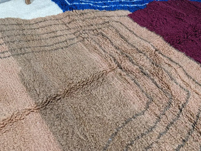 Beige woolen moroccan handmade traditional azilal rug with textured plush surface and geometric patterned design