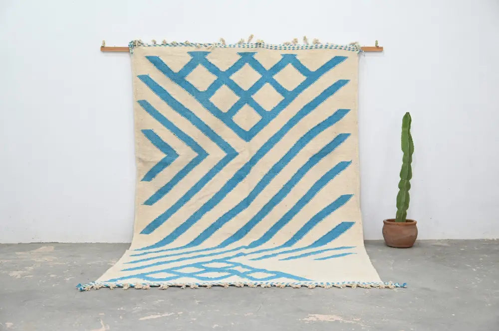 Beige and blue geometric patterned moroccan handmade traditional azilal rug with fringed edges by DecorBites™