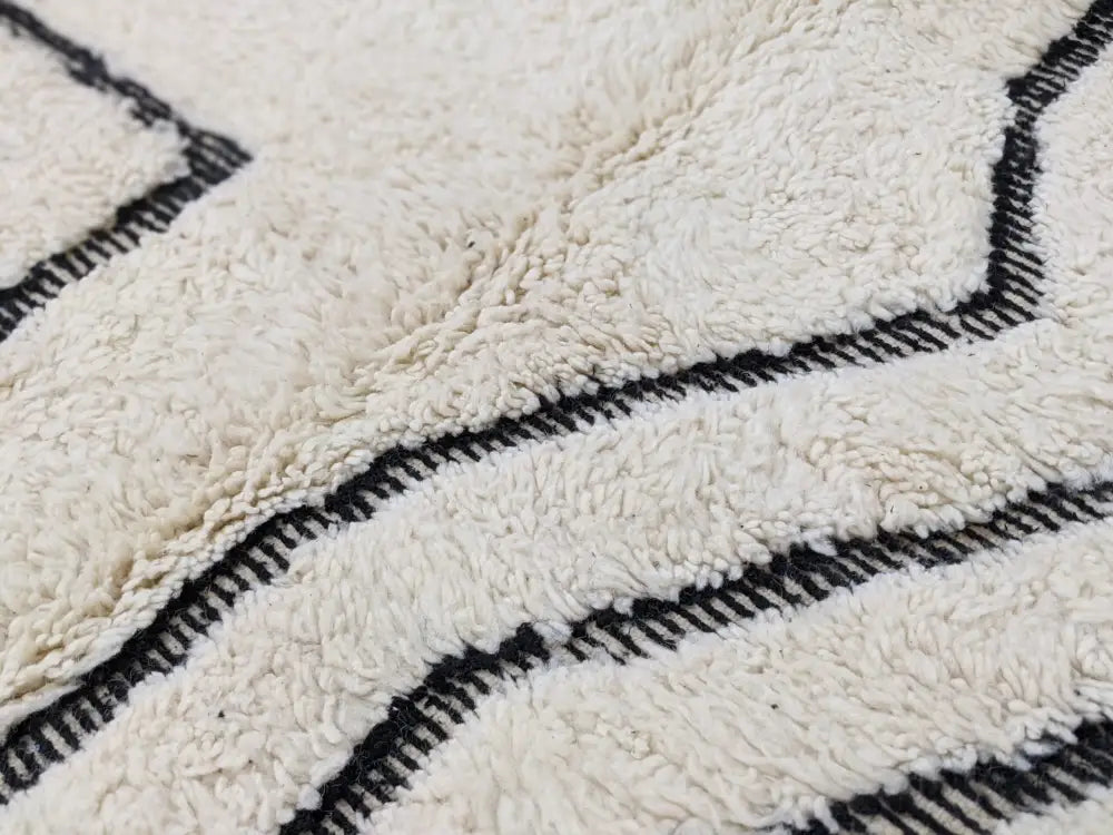 Cream-colored plush wool beni ouarain rug with bold black geometric stripes moroccan handmade 285 x 194 cm