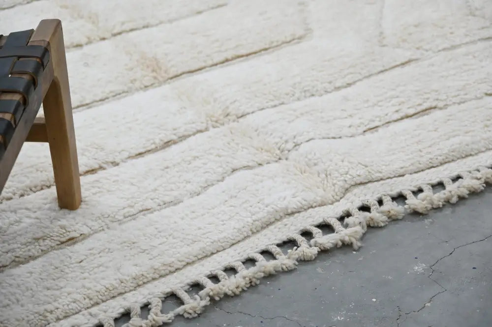 Cream-colored plush shag beni ouarain rug with textured woven fringe from DecorBites™ Moroccan handmade collection