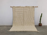 Beige moroccan handmade beni ouarain rug with geometric pattern and fringed edges 300 x 200 cm from DecorBites