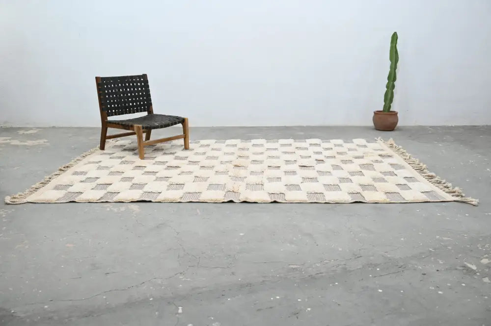 Beige and gray woven beni ouarain rug with checkerboard pattern and fringed edges 300 x 203 cm by decorbites