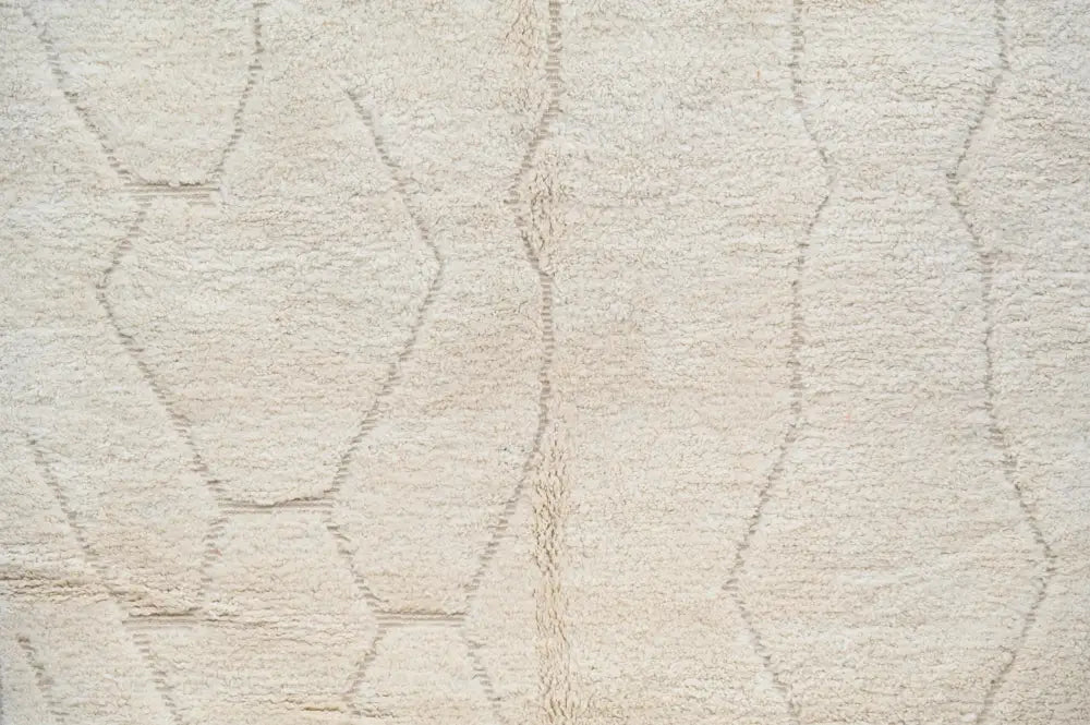 Cream-colored plush wool beni ouarain rug with subtle geometric stitched hexagons moroccan handmade design