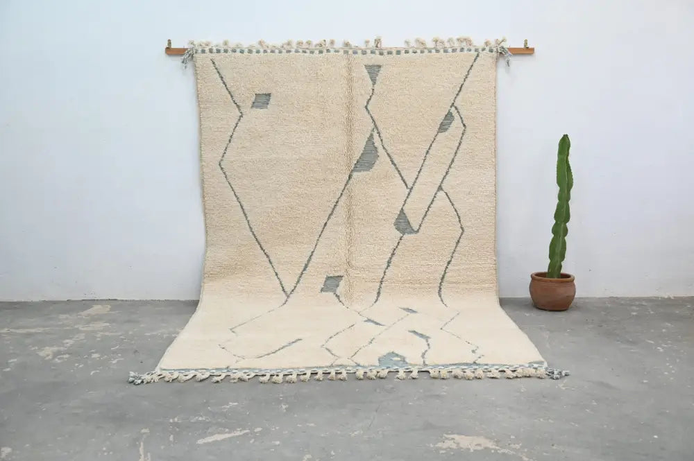 Beige moroccan handmade beni ouarain rug with gray geometric patterns and fringed edges 305 x 205 cm by DecorBites