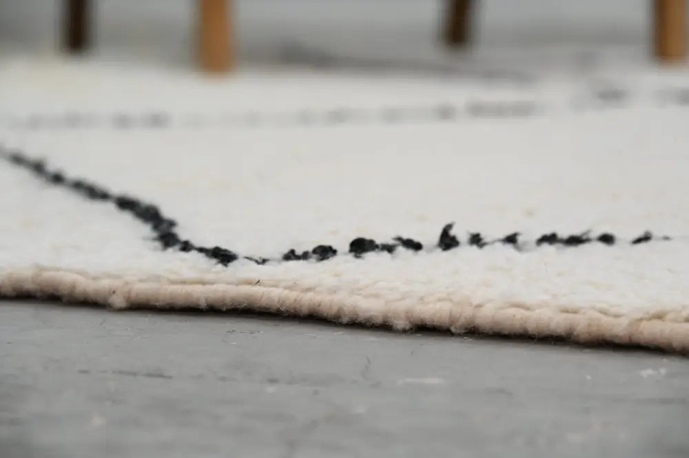 Decorbites™ moroccan handmade beni ouarain rug in cream wool with a simple black stitched border 309 x 204 cm