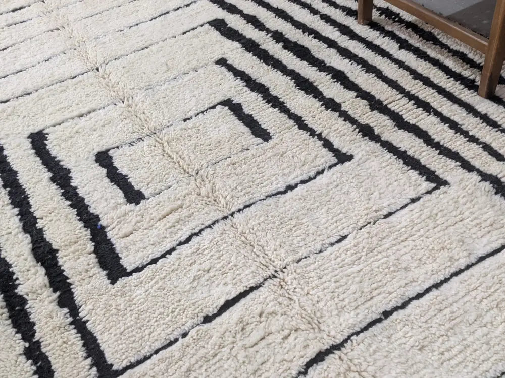 Cream-colored plush wool beni ouarain rug with bold black geometric stripes moroccan handmade traditional design
